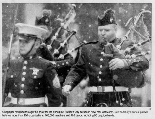 Bagpiper marched through snow for the annual St. Patrick's parade